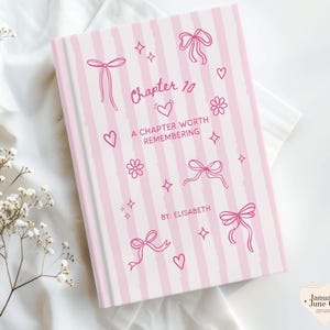 May include: A hardcover book with a pink and white striped cover. The cover features pink bows, hearts, flowers, and stars. The title "Chapter 10" and the phrase "A Chapter Worth Remembering" are written in pink. The author's name is "Elisabeth."