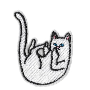 May include: White embroidered iron-on patch of a white cat with blue eyes and pink ears, lying on its back with its paw in its mouth.