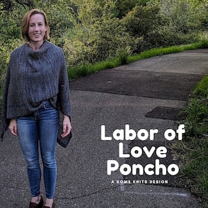 May include: A woman wearing a grey knitted poncho and blue jeans stands on a paved path. The text "Labor of Love Poncho" is written in white letters on the path. The text "A Dome Knits Design" is written in smaller white letters below the first text.