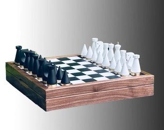 May include: A wooden chessboard with black and white squares, featuring a set of black and white chess pieces. The board is closed and the pieces are arranged in their starting positions.