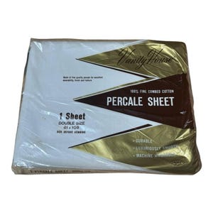 May include: A packaged double-size percale sheet from Vanity House. The package is white with gold and brown accents, and features text indicating it's 100% fine combed cotton, durable, and machine washable. The sheet measures 81 x 108 inches.