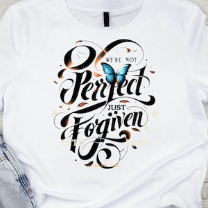 May include: White t-shirt with black lettering that reads "We're not perfect, just forgiven." A blue butterfly is centred above the text.