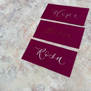 calligraphy wedding and event flat place cards rich pink magenta orchid hand lettered personalised guest name setting image 3