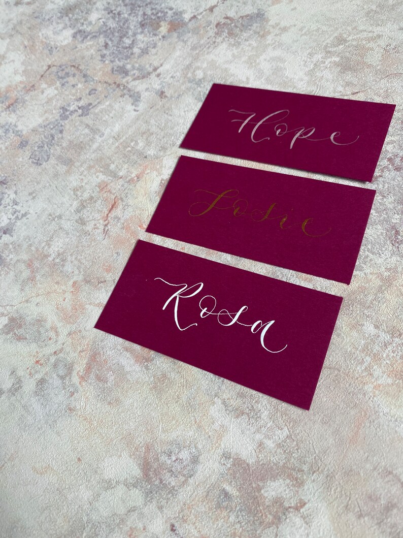 calligraphy wedding and event flat place cards rich pink magenta orchid hand lettered personalised guest name setting image 3