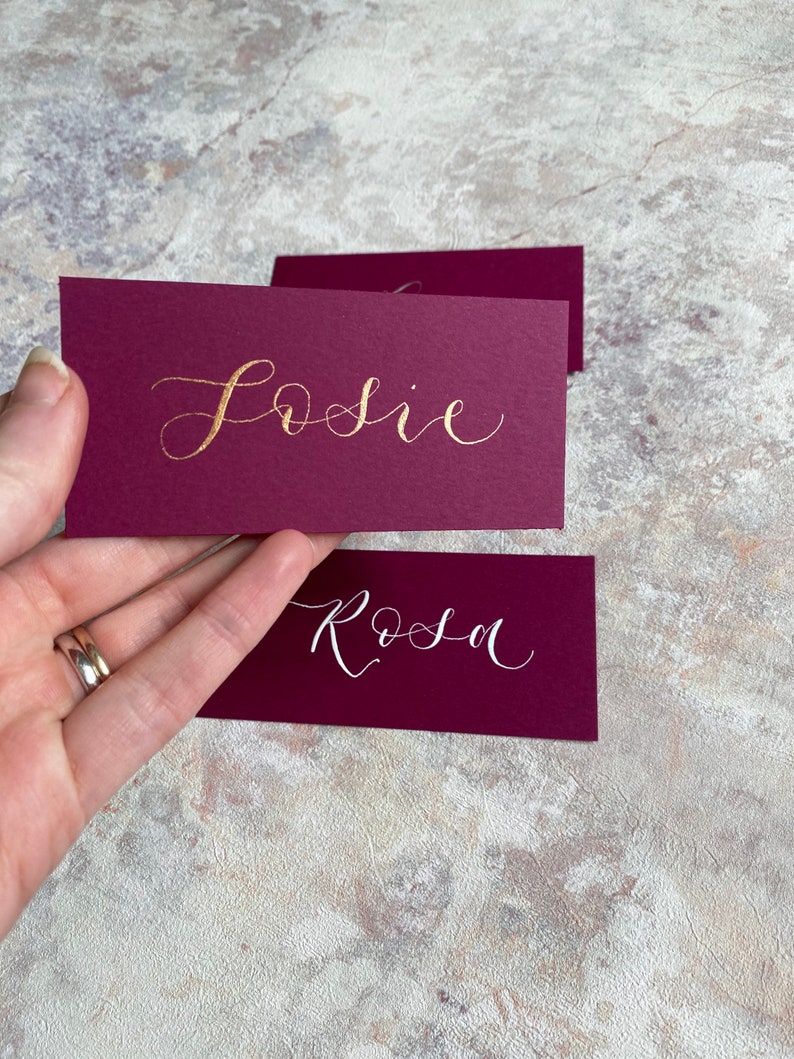 calligraphy wedding and event flat place cards rich pink magenta orchid hand lettered personalised guest name setting image 2