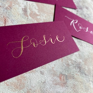 calligraphy wedding and event flat place cards rich pink magenta orchid hand lettered personalised guest name setting image 1
