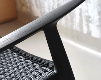 minimalistic  STICK lounge chair. solid wood frame with danish paper cord sitting.  Midcentury style armchair