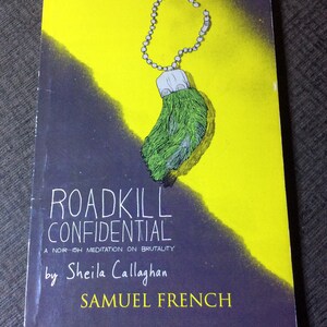 May include: A book cover with a yellow and purple background. The title is "Roadkill Confidential: A Noir-ish Meditation on Brutality" by Sheila Callaghan and Samuel French. A green furry paw with a silver chain is hanging from the top of the cover.