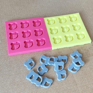 Resin manchega figures mold, for earrings or key rings.