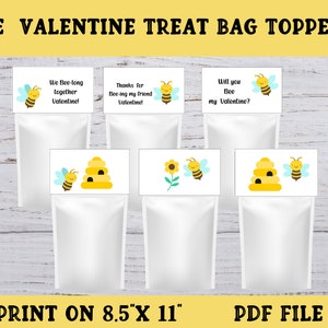May include: Six printable treat bag toppers featuring a bee and beehive design. The toppers include the text "We Bee-long together Valentine!" "Thanks for Bee-ing my friend Valentine!" and "Will you Bee my Valentine?"  Print on 8.5 x 11 inch paper.