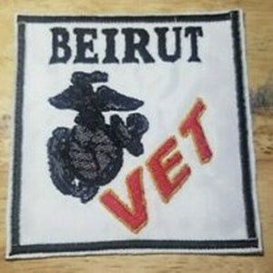 May include: White patch with black embroidered text "BEIRUT" and a black embroidered Marine Corps emblem. Below the emblem is red embroidered text "VET".