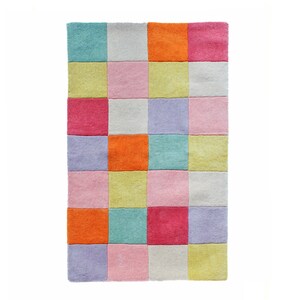 May include: A colourful patchwork rug with squares in shades of pink, yellow, orange, purple, and blue.