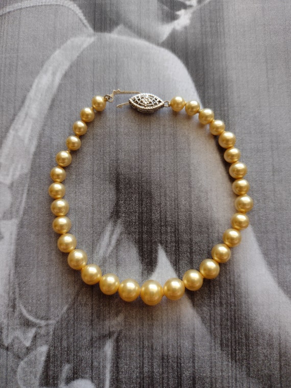 Vintage 10k white gold clasp and warm golden pearl