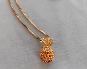 Vintage retro gold tone and crystal accented Hawaiian pineapple pendant on a gold tone necklace chain