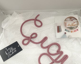 Baby Nursery Name Sign Decor. A personalised customisable knitted wire word gift for a newborn baby and keepsake present for a new mum.