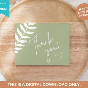 May include: A green thank you card with a white fern design and the text "Thank you!" in white cursive. The text "business name" is also included in white cursive.