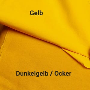 May include: Two layers of solid-colored fabric are displayed. The top layer is a bright, vibrant yellow with the text 'Gelb' printed on it. The bottom layer is a deeper, muted mustard yellow with the text 'Dunkelgelb / Ocker' printed below.