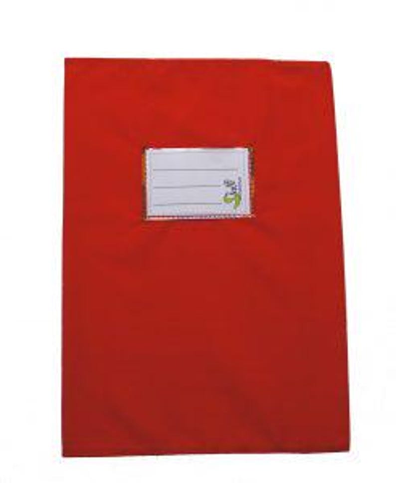 May include: A rectangular red notebook featuring a centered white label with three horizontal lines for writing. The label includes a small green graphic icon in the bottom right corner. The notebook cover has a smooth, solid red finish.