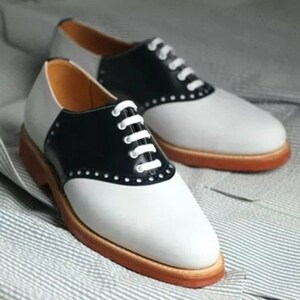 White bucks hotsell and saddle shoes