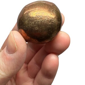 May include: A copper sphere with a smooth, slightly textured surface. The sphere is approximately 31 mm in diameter.  "Copper Sphere 31mm" is written in orange text above the sphere.