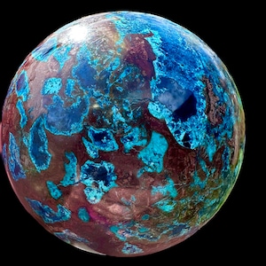 Puede incluir: Una esfera azul y marrón con un patrón de mármol. La esfera tiene una superficie lisa y brillante.