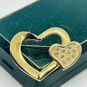 Vintage double  brooch/ pin in the form of a heart in gold tone with crystals.