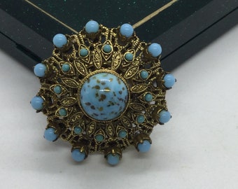 Broche/broche fleur vintage dorée avec stoun bleu turquoise