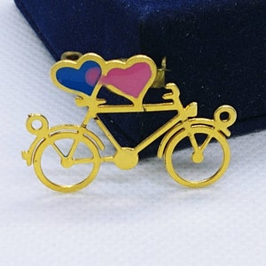 Vintage sportfiets/bakbroche goudkleurig met emaille
