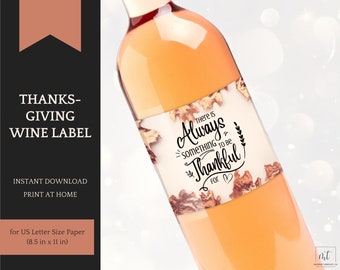 May include: Printable wine label featuring a fall-themed design with brown leaves and the text "There is Always Something to Be Thankful For". The label is designed for US Letter size paper, 8.5 inches by 11 inches.