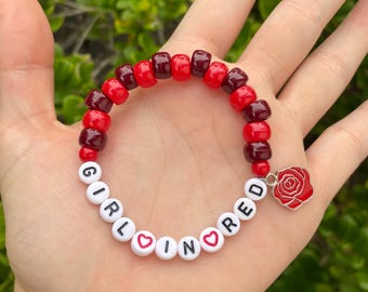 girl in red kandi bead stretch bracelet handmade with optional rose charm