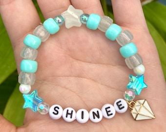 SHINee Pearl Aqua friendship kandi bracelet with glow-in-the-dark beads, letter beads, and pony beads and optional enamel charm