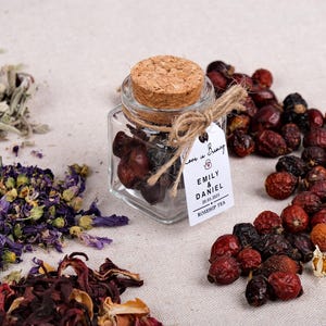 Wedding Tea Favors for Guests – Loose Leaf Herbal Tea Jars | Rustic Wedding Guest Gifts | Personalized Bridal Shower Favors | Tea Party Favors

Delight your guests with these charming Wedding Tea Favors – elegant glass jars filled with premium loose leaf herbal tea, personalized for your special day. These rustic favors are perfect for weddings, bridal showers, tea parties, or engagement celebrations, offering a thoughtful and aromatic thank-you gift your guests will truly enjoy.