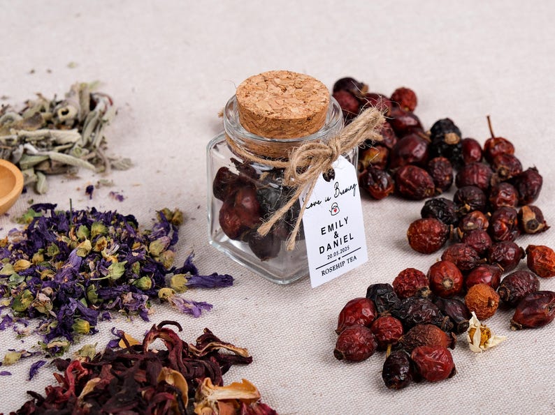 Wedding Tea Favors for Guests – Loose Leaf Herbal Tea Jars | Rustic Wedding Guest Gifts | Personalized Bridal Shower Favors | Tea Party Favors

Delight your guests with these charming Wedding Tea Favors – elegant glass jars filled with premium loose leaf herbal tea, personalized for your special day. These rustic favors are perfect for weddings, bridal showers, tea parties, or engagement celebrations, offering a thoughtful and aromatic thank-you gift your guests will truly enjoy.