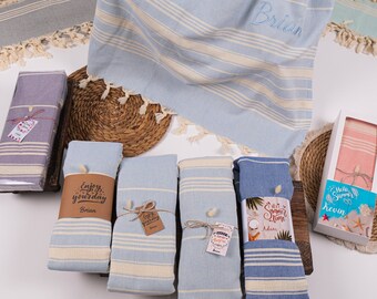 May include: Five blue and white striped towels with personalized tags. The tags have different messages, including "Enjoy your day", "It's Summer Time", and "Hello Summer".