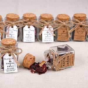 Wedding Tea Favors for Guests – Loose Leaf Herbal Tea Jars | Rustic Wedding Guest Gifts | Personalized Bridal Shower Favors | Tea Party Favors

Delight your guests with these charming Wedding Tea Favors – elegant glass jars filled with premium loose leaf herbal tea, personalized for your special day. These rustic favors are perfect for weddings, bridal showers, tea parties, or engagement celebrations, offering a thoughtful and aromatic thank-you gift your guests will truly enjoy.