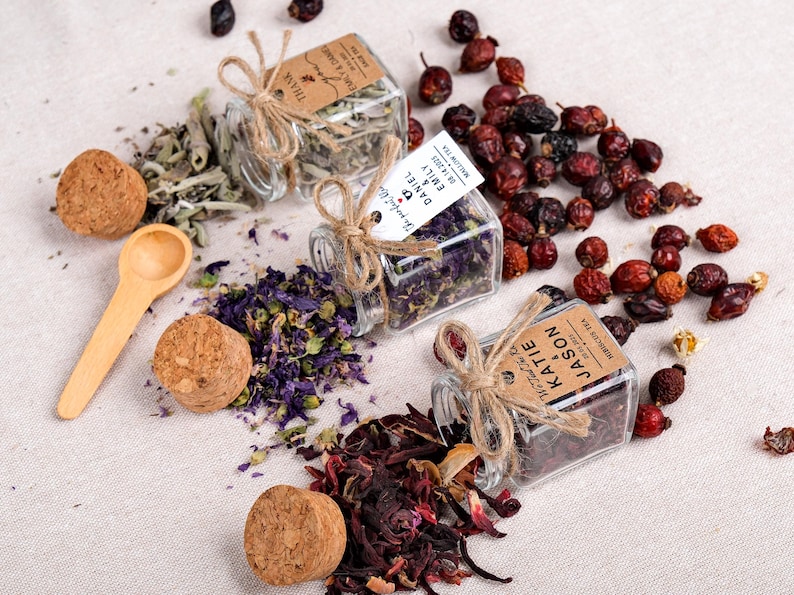 Wedding Tea Favors for Guests – Loose Leaf Herbal Tea Jars | Rustic Wedding Guest Gifts | Personalized Bridal Shower Favors | Tea Party Favors

Delight your guests with these charming Wedding Tea Favors – elegant glass jars filled with premium loose leaf herbal tea, personalized for your special day. These rustic favors are perfect for weddings, bridal showers, tea parties, or engagement celebrations, offering a thoughtful and aromatic thank-you gift your guests will truly enjoy.