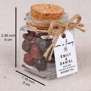 Wedding Tea Favors for Guests – Loose Leaf Herbal Tea Jars | Rustic Wedding Guest Gifts | Personalized Bridal Shower Favors | Tea Party Favors

Delight your guests with these charming Wedding Tea Favors – elegant glass jars filled with premium loose leaf herbal tea, personalized for your special day. These rustic favors are perfect for weddings, bridal showers, tea parties, or engagement celebrations, offering a thoughtful and aromatic thank-you gift your guests will truly enjoy.