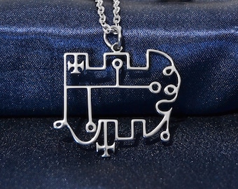 May include: A silver necklace with a pendant shaped like a stylized symbol. The pendant is made of a single piece of metal and has a detailed design.