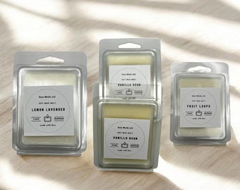 May include: Four soy wax melts in clear plastic containers. The scents are Lemon Lavender, Vanilla Bean, Fruit Loops, and Vanilla Bean. Each container has a white label with the scent name and the company name, "Kate Wicks LLC".