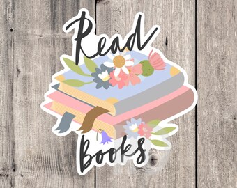 May include: A sticker with a stack of books, flowers, and the text "Read Books".