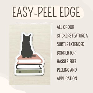 May include: A black cat silhouette sits atop a stack of three books in a sticker design. The sticker has a white border and the text "EASY-PEEL EDGE" is at the top. The text on the right side says "ALL OF OUR STICKERS FEATURE A SUBTLE EXTENDED BORDER FOR HASSLE-FREE PEELING AND APPLICATION."