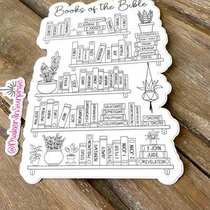 May include: A white sticker featuring a bookshelf design with the words "Books of the Bible" at the top. The shelves are filled with book titles, and there are potted plants on the shelves. The sticker has a decorative outline.