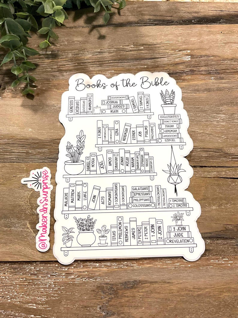 May include: A white sticker featuring a bookshelf design with the words "Books of the Bible" at the top. The sticker includes the names of the books of the Bible, arranged as if they were books on shelves, with potted plants.