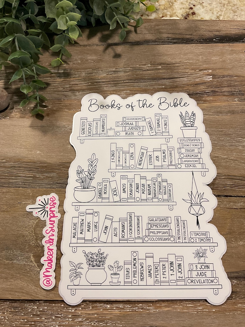 May include: A white sticker featuring a bookshelf design with the words "Books of the Bible" at the top. The sticker lists the books of the Bible on the shelves, with potted plants on the shelves. The sticker also has the text "@MakerInSurprise".