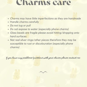 May include: A text-based care guide for charms, with a light yellow background and a pattern of cartoon bunnies. The text reads "Charms care" and includes instructions for handling charms, such as "Handle charms carefully" and "Do not expose to water (especially phone charms)".