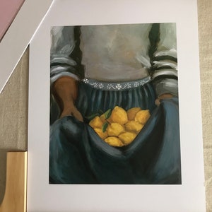 May include: A painting of a person holding a bunch of lemons in a blue skirt and a grey sweater with white stripes.