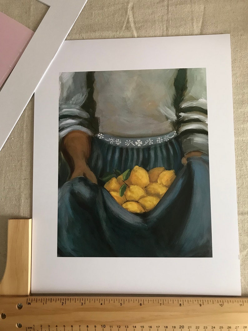 May include: A painting of a person holding a bunch of lemons in a blue skirt and a grey sweater with white stripes.