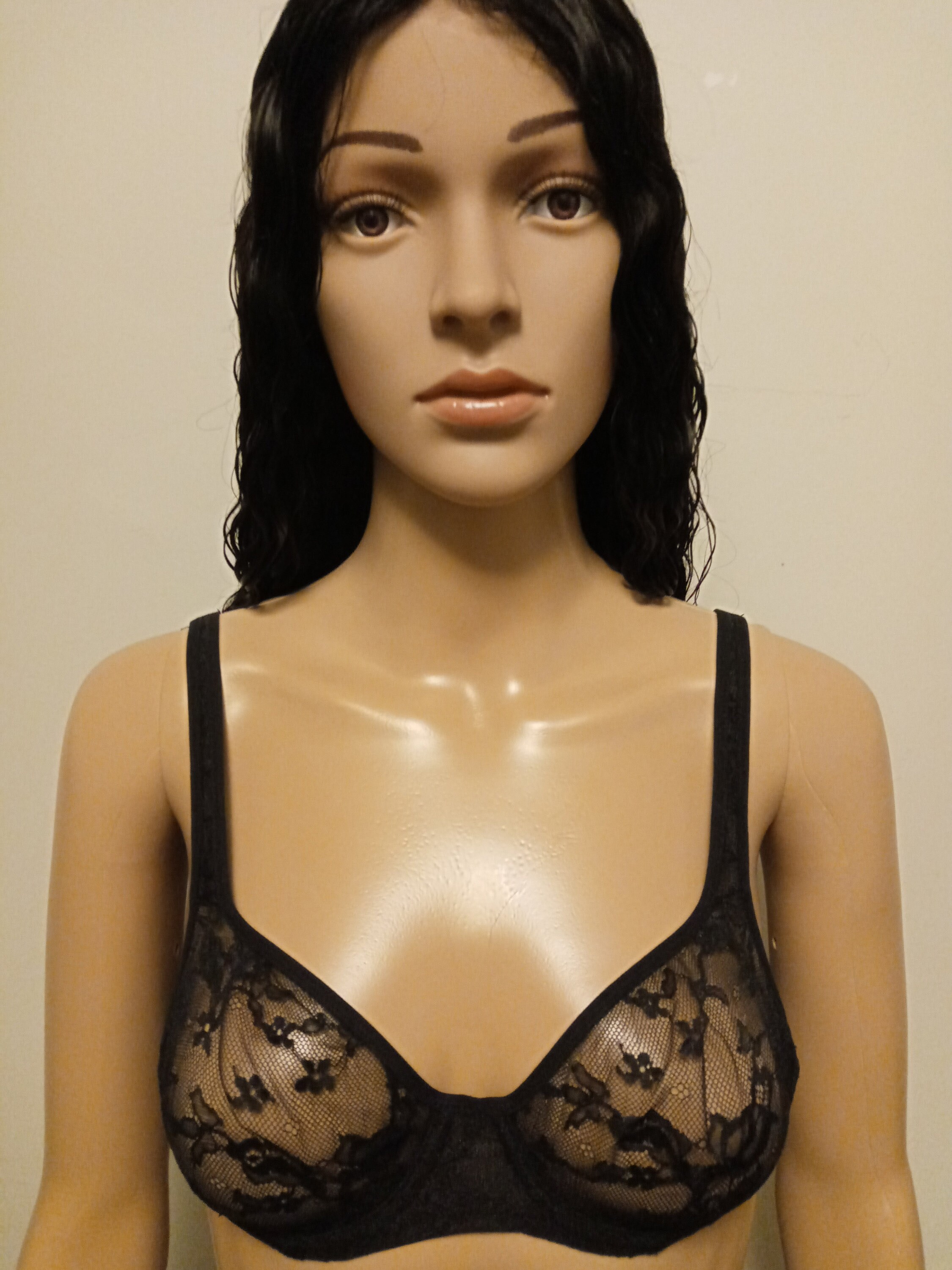 Trying bra. Bra design bra maker с. bra maker. looking at the bra.