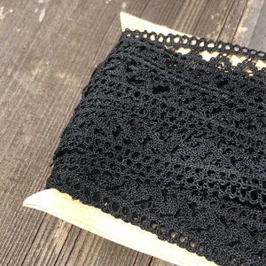 Vintage black crochet lace on original card. Over 9 metres total. In very good vintage condition. Dainty lightweight design. 2cm wide.
