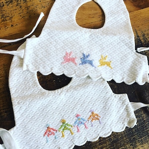 The sweetest new baby pair of vintage French handmade embroidered baby bibs. Adorable designs to both. White cotton - Excellent baby gift!